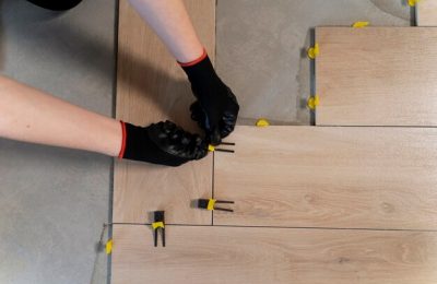flat-lay-worker-tiling-floor_23-2149343997